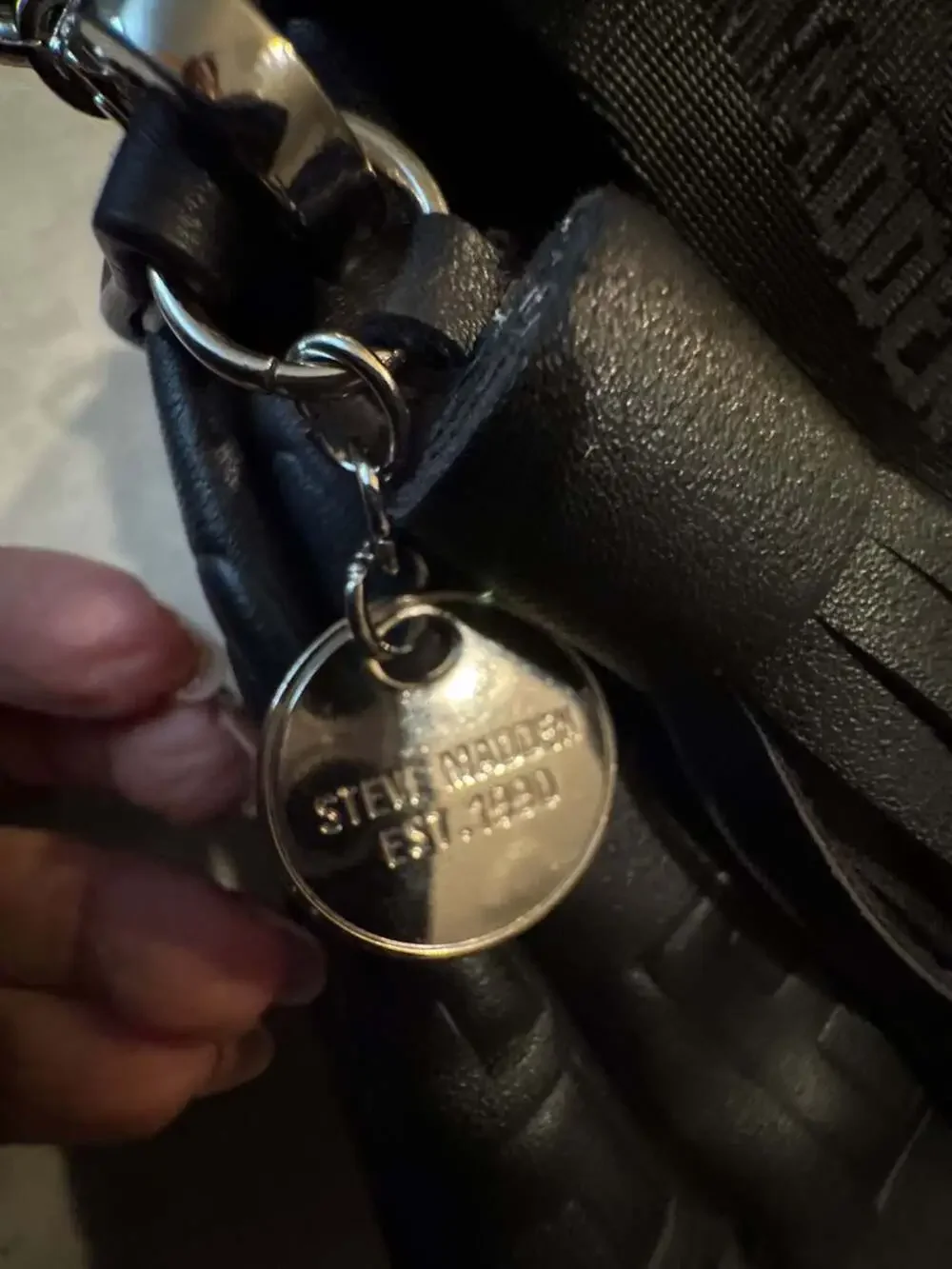 Steve Madden Black Mini Backpack Purse with Embossed Logo and Tassel